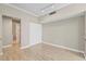 Spacious living area with a glimpse of a walk-in closet and a full bathroom at 9842 Lake Chase Island Way, Tampa, FL 33626