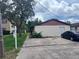 Charming single-story home with a well-maintained lawn and classic design at 9902 N Myrtle St, Tampa, FL 33617