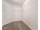 Walk-in closet featuring built-in shelving at 10847 Kirkwall Port Dr, Wimauma, FL 33598