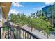 Balcony view featuring lush trees, a cityscape, and a clear sky, providing a serene outdoor space at 113 S Sherrill St # 113, Tampa, FL 33609