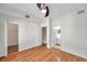 Bedroom features hardwood floors, a ceiling fan, closet and bathroom entrances at 113 S Sherrill St # 113, Tampa, FL 33609