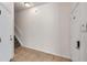 Inviting entryway featuring neutral-colored tile flooring and access to the staircase at 113 S Sherrill St # 113, Tampa, FL 33609