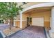 Exterior view of the property, showcasing the front door, garage, and landscaping at 113 S Sherrill St # 113, Tampa, FL 33609