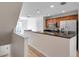 Well-lit kitchen with granite countertops and stainless steel refrigerator at 113 S Sherrill St # 113, Tampa, FL 33609