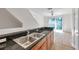 Kitchen with bar, stainless appliances and hardwood floors at 113 S Sherrill St # 113, Tampa, FL 33609
