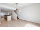 Open-concept living space with hardwood floors and staircase at 113 S Sherrill St # 113, Tampa, FL 33609