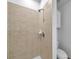 Bathroom shower area with neutral tile, handheld shower, and built in soap dish at 113 S Sherrill St # 113, Tampa, FL 33609