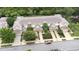 Aerial view of townhomes with private driveways, well-maintained landscaping, and community playground at 11546 52Nd E Ct, Parrish, FL 34219