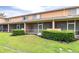Exterior view of the backyard with screened-in patios and lush green grass, ideal for relaxing and outdoor enjoyment at 11546 52Nd E Ct, Parrish, FL 34219