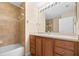Full bathroom featuring a shower, bathtub and single sink vanity with wooden cabinets at 11546 52Nd E Ct, Parrish, FL 34219