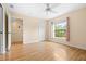 Bright bedroom with a ceiling fan, and a window allowing natural light to illuminate the space at 11546 52Nd E Ct, Parrish, FL 34219