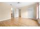 Light and airy bedroom with wood floors and access to a walk-in closet and bathroom at 11546 52Nd E Ct, Parrish, FL 34219