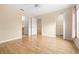 Bright bedroom featuring wood floors, a closet and an access to a bathroom with a wooden vanity at 11546 52Nd E Ct, Parrish, FL 34219