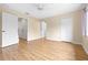 Large bedroom featuring light walls, a ceiling fan, and multiple doors leading to other rooms at 11546 52Nd E Ct, Parrish, FL 34219