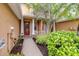 Inviting entrance featuring beautiful landscaping and walkway leading to the front door with sidelights at 11546 52Nd E Ct, Parrish, FL 34219