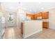 Bright kitchen with hardwood cabinets, tile floor and stainless microwave at 11546 52Nd E Ct, Parrish, FL 34219