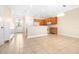 Bright kitchen with hardwood cabinets, tile floor and stainless microwave at 11546 52Nd E Ct, Parrish, FL 34219