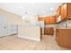 Bright kitchen featuring ceramic tile flooring and wooden cabinets with modern appliances at 11546 52Nd E Ct, Parrish, FL 34219