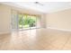 Bright living room with tile flooring and sliding glass doors to the outdoors at 11546 52Nd E Ct, Parrish, FL 34219