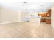 Open-concept living area with tile flooring connecting to the kitchen at 11546 52Nd E Ct, Parrish, FL 34219