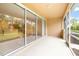 The outdoor patio boasts a screened-in area with sliding glass doors leading indoors, seamlessly blending indoor and outdoor living at 11546 52Nd E Ct, Parrish, FL 34219