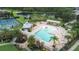 Aerial view of the community pool, clubhouse, and lounge area with view of pond at 11546 52Nd E Ct, Parrish, FL 34219