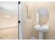 Clean powder room featuring a pedestal sink and neutral decor at 11546 52Nd E Ct, Parrish, FL 34219