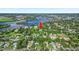 Scenic aerial view showcasing the property's location amidst lush greenery and proximity to a waterfront community at 1217 N Florida Ave, Tarpon Springs, FL 34689