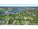 Scenic aerial view showcasing the property's location amidst lush greenery and proximity to a waterfront community at 1217 N Florida Ave, Tarpon Springs, FL 34689