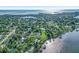 Stunning aerial view of waterfront homes surrounded by lush greenery and sparkling waterways at 1217 N Florida Ave, Tarpon Springs, FL 34689