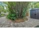 Landscaped backyard with sitting area and shed at 1217 N Florida Ave, Tarpon Springs, FL 34689