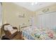 Bedroom boasts cottage style furniture, wood floors, natural lighting, and neutral colors at 1217 N Florida Ave, Tarpon Springs, FL 34689