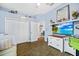Bright bedroom features wood floors, light blue walls, and a modern TV with drawers at 1217 N Florida Ave, Tarpon Springs, FL 34689