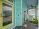 Charming front porch with colorful accents, decorative details, and a cozy seating area at 1217 N Florida Ave, Tarpon Springs, FL 34689