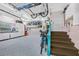 Spacious garage with painted floors, plenty of storage, and staircase access at 1217 N Florida Ave, Tarpon Springs, FL 34689