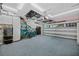 Spacious garage with epoxy flooring, ample storage, and organizational features at 1217 N Florida Ave, Tarpon Springs, FL 34689