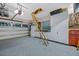 Well-organized garage with epoxy floors, storage cabinets, and attic access at 1217 N Florida Ave, Tarpon Springs, FL 34689
