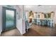 Spacious kitchen featuring an ornate glass door, center island, and hardwood floors at 1217 N Florida Ave, Tarpon Springs, FL 34689