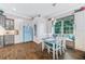 Charming kitchen featuring a retro-style refrigerator, breakfast nook and wood floors at 1217 N Florida Ave, Tarpon Springs, FL 34689