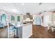 Spacious kitchen with large island, custom cabinets, and a vintage-style refrigerator at 1217 N Florida Ave, Tarpon Springs, FL 34689