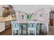 Spacious kitchen features an island with seating, custom cabinets, and coastal decor at 1217 N Florida Ave, Tarpon Springs, FL 34689
