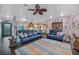 Open-concept living area with hardwood floors and bright and airy lighting and decor at 1217 N Florida Ave, Tarpon Springs, FL 34689