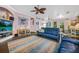 Open-concept living room with hardwood floors, ceiling fan, and view of the kitchen at 1217 N Florida Ave, Tarpon Springs, FL 34689