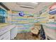Shed interior is decorated with multicolored wood paneling and a leather recliner at 1217 N Florida Ave, Tarpon Springs, FL 34689