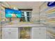 Home office with a large desk and a built-in credenza at 1217 N Florida Ave, Tarpon Springs, FL 34689