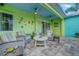 Welcoming patio with seating, ceiling fans, and accents creating a relaxing outdoor space at 1217 N Florida Ave, Tarpon Springs, FL 34689