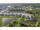 Beautiful aerial view of a residential community with ponds and lush greenery at 12593 Retreat Pl, Spring Hill, FL 34610