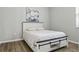 Serene bedroom with white bed frame and a calm atmosphere, perfect for relaxation at 12593 Retreat Pl, Spring Hill, FL 34610