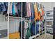 Spacious walk-in closet with custom shelving and ample storage for clothes, shoes, and accessories at 12593 Retreat Pl, Spring Hill, FL 34610