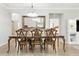 A spacious dining area with a chandelier and ornate wooden table and chairs at 12593 Retreat Pl, Spring Hill, FL 34610